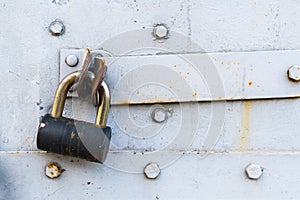 Aged rusted metall gate closed steel old padlock safety