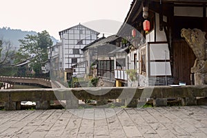 Aged stone bridge over river in ancient town