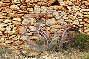Aged weathered bicycle vintage stone wall