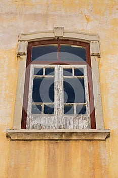 Aged window with peeling paint.