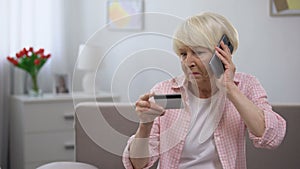 Aged woman calling children asking for help with using banking card, generation