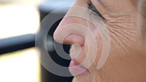 Aged woman crying, remembering departed native person, pain of loss, close-up