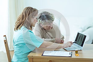 Aged woman during medical consultation