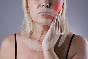 Aged woman with toothache, teeth pain closeup photo