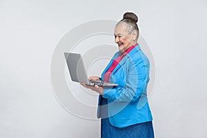 Aged woman work in computer