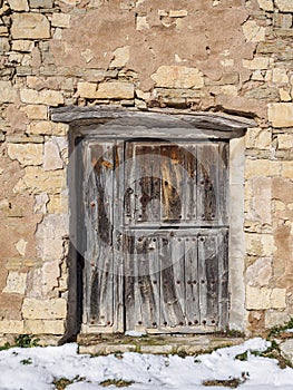 Aged wooden door of a European rural village