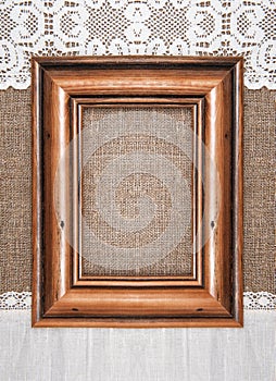 Aged wooden frame on the burlap