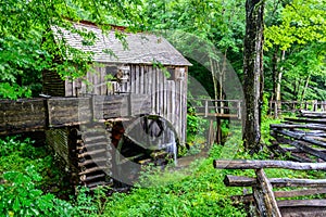 Aged wooden mill, in a lush green wooded area in Great Smokey Mountain National Park in Tennessee