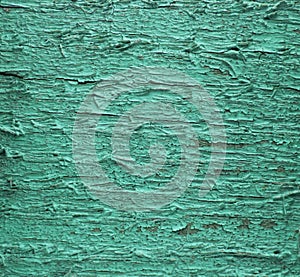 Aged wooden surface. With cracked cold green paints