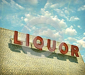 Aged and worn vintage liquor store sign