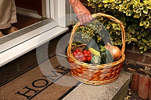 Ageing Hand Reaching For Vegetable Basket.