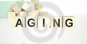 Ageing - word from wooden blocks with letters photo