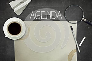 Agenda concept on black blackboard with empty