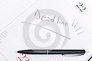 Agenda with deadline date and pen