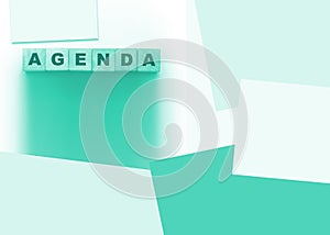 Agenda word on wooden blocks on white, color paper around. Business concept