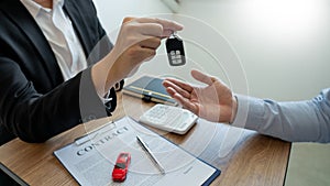 Agent broker man holding document showing an transportation contract form to client ownership  customer and salesman with car key