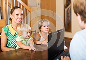 Agent consulting woman with kids