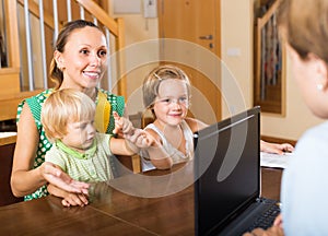 Agent consulting woman with kids