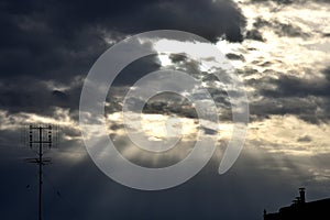 Agglomerations of clouds torn by the rays of the sun