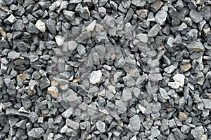 Aggregate of coarse gray stones, crushed at a stone pit, gravel pattern photo