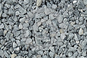 Aggregate / gravel pattern - a heap of coarse gray stones, crushed at a stone pit