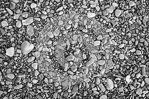 Aggregate of rounded coastal gray stones, coastal pebble pattern