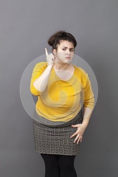 Aggresive overweight young woman telling off