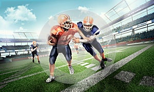 Aggression american football players on grass in stadium