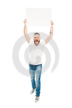 Aggressive bearded man holding blank banner above head,