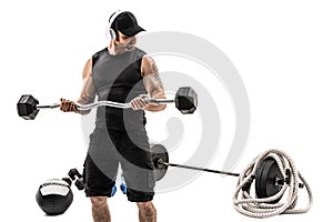 Aggressive bearded strong muscular Man in sportswear workout with barbell on white isolate