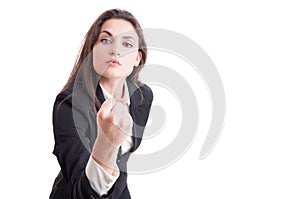 Aggressive business woman, leader or bossy manager showing fist