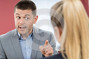 Aggressive Businessman Bullying Female Colleague In Office