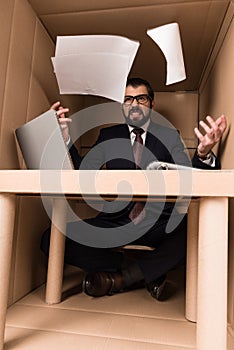 Businessman throwing documents