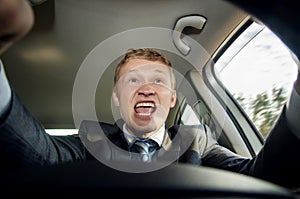 Aggressive driver behind the wheel of a car