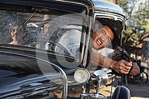 Aggressive Gangster Shooting from Car