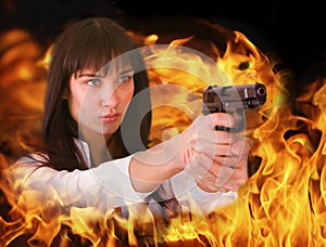 Aggressive girl shoots from flame.