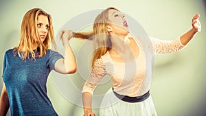 Aggressive mad women fighting each other. photo