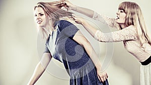 Aggressive mad women fighting each other. photo