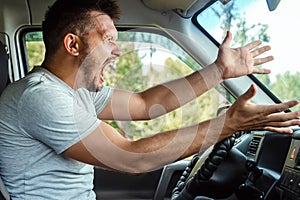 Aggressive Man, the driver of the car is outraged at the wheel during the trip. Emergency, accident, violation of rights, dispute