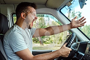 Aggressive Man, the driver of the car is outraged at the wheel during the trip. Emergency, accident, violation of rights, dispute