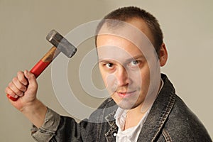 Aggressive man with a hammer
