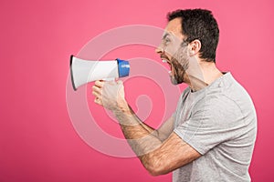 aggressive man shouting with megaphone, isolated