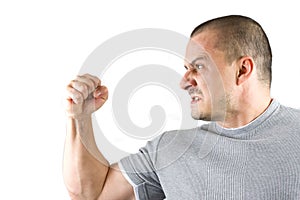 Aggressive man showing his fist isolated on white
