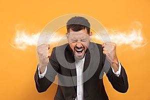 Aggressive man with steam coming out of his ears on background