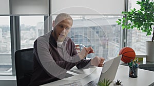 Aggressive man videocalling computer at home office close up. Employee screaming