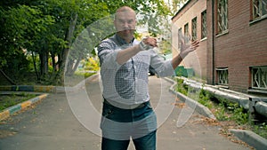 Aggressive offensive man with a chain in his hands