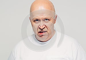 Aggressive senior man portrait white background
