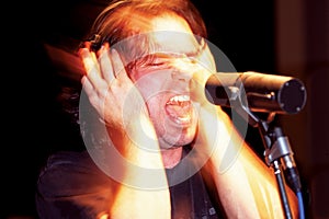 Aggressive singer in studio photo