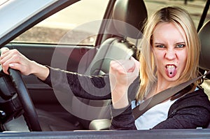 Aggressive student girl driving car,