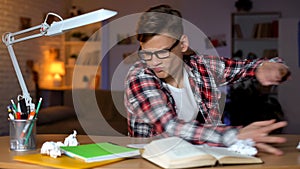 Aggressive student throwing books of table, cannot solve assignment, hard task